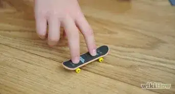 Ollie on a Tech Deck Using Three Fingers