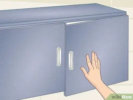 Image titled Fix a Cabinet Door Hinge Step 1