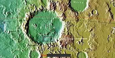 Galle crater.  Colors show elevations.  Arrow indicates a layered mound that is enlarged in other images to follow.